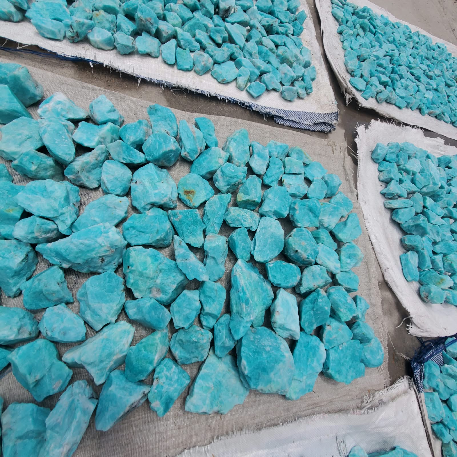 Grouped rough amazonite pieces with naturally irregular shape