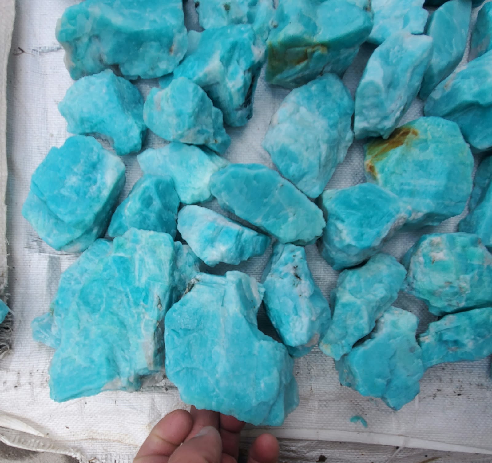 Close view of natural rough blue amazonite pieces